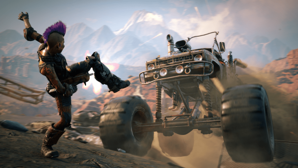A futuristic white person with a mohawk has a foot raised while a low-budget monster truck barrels over rocks toward them. In the background are snow-capped mountains, but the foreground looks like mostly desert.