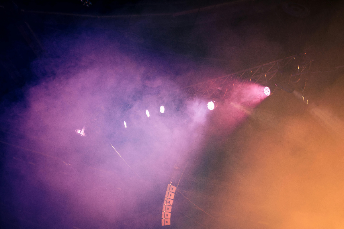 Stage lights shining through haze